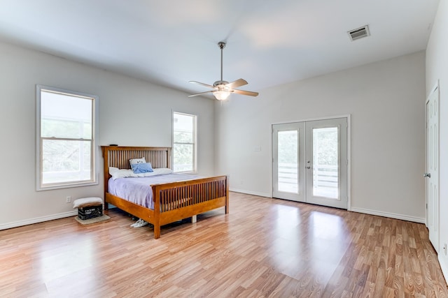131 Canary Ln, Coldspring, TX 77331 - bedroom featuring access to outside, light wood-style flooring, french doors, and a ceiling fan