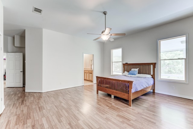 131 Canary Ln, Coldspring, TX 77331 - bedroom featuring multiple windows and light wood-style floors