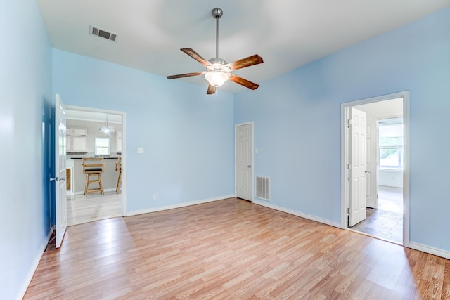 131 Canary Ln, Coldspring, TX 77331 - unfurnished living room with light wood finished floors and ceiling fan