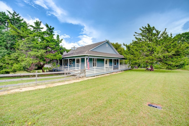 131 Canary Ln, Coldspring, TX 77331 - farmhouse with a shingled roof and a porch