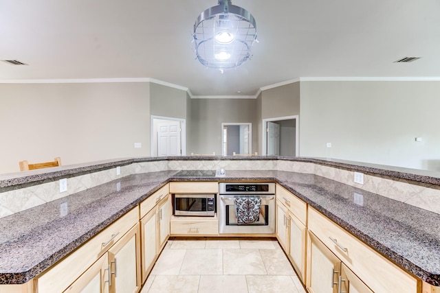 131 Canary Ln, Coldspring, TX 77331 - kitchen featuring stainless steel appliances, ornamental molding, light brown cabinetry, light tile patterned floors, and dark stone countertops