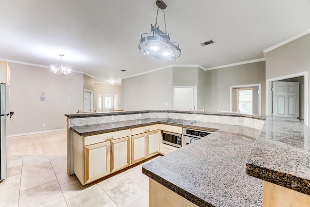 131 Canary Ln, Coldspring, TX 77331 - kitchen featuring ornamental molding, light brown cabinetry, stainless steel appliances, a chandelier, and pendant lighting