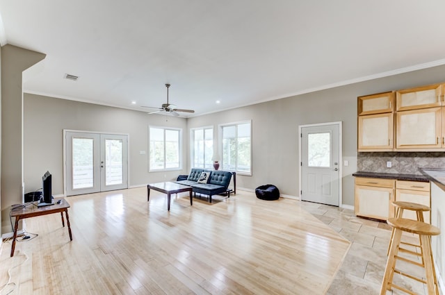 131 Canary Ln, Coldspring, TX 77331 - living room with french doors, plenty of natural light, ceiling fan, crown molding, and recessed lighting