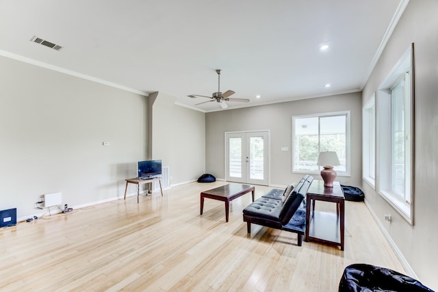 131 Canary Ln, Coldspring, TX 77331 - living room with crown molding, french doors, light wood finished floors, recessed lighting, and a ceiling fan
