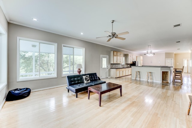 131 Canary Ln, Coldspring, TX 77331 - living area featuring crown molding, light wood-style floors, recessed lighting, and ceiling fan