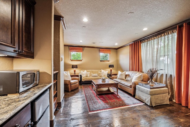 3751 Aberdeen Way, Houston, TX 77025 - living area with dark wood-type flooring, a textured ceiling, recessed lighting, and crown molding