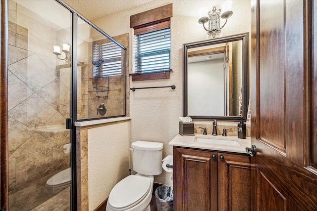 3751 Aberdeen Way, Houston, TX 77025 - bathroom featuring vanity, a shower stall, and a textured wall