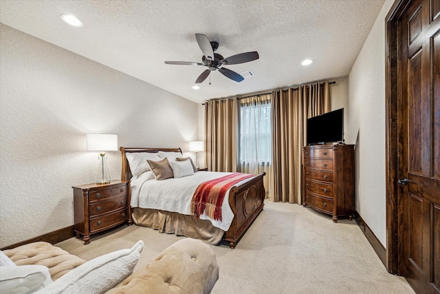 3751 Aberdeen Way, Houston, TX 77025 - bedroom with light colored carpet, recessed lighting, a ceiling fan, a textured ceiling, and a textured wall