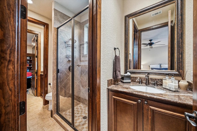 3751 Aberdeen Way, Houston, TX 77025 - full bath with a stall shower, vanity, a ceiling fan, a textured wall, and tile patterned flooring