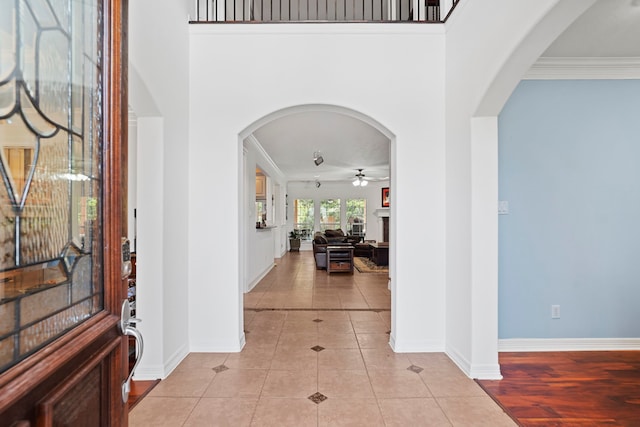 2326 Vinemead Ct, Katy, TX 77450 - foyer entrance featuring ceiling fan, light tile patterned flooring, a towering ceiling, and arched walkways