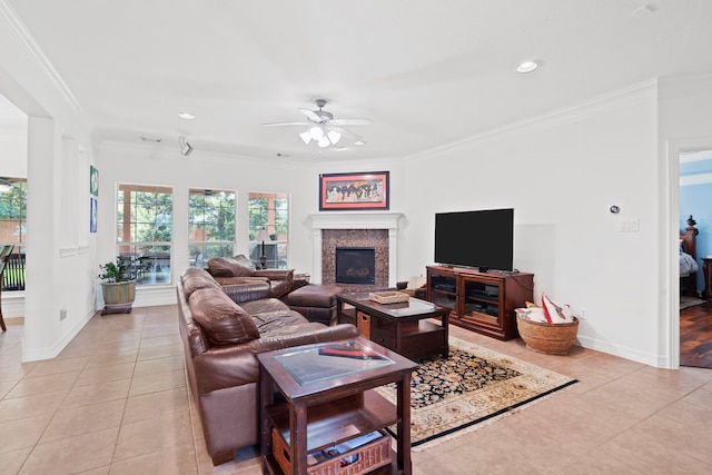 2326 Vinemead Ct, Katy, TX 77450 - living room with light tile patterned floors, a ceiling fan, a fireplace, ornamental molding, and recessed lighting