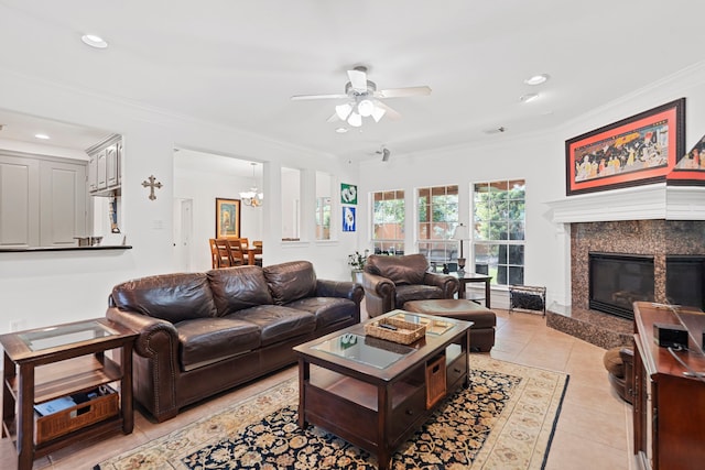 2326 Vinemead Ct, Katy, TX 77450 - living room featuring ceiling fan, ornamental molding, a chandelier, a premium fireplace, and recessed lighting