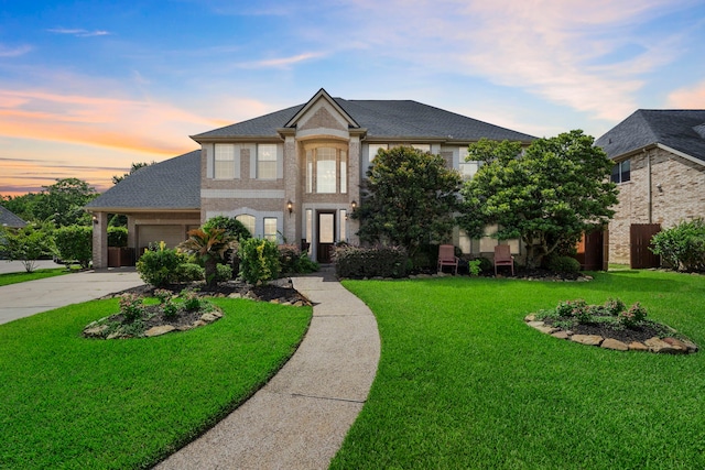 2326 Vinemead Ct, Katy, TX 77450 - view of front of house with driveway, a yard, and brick siding