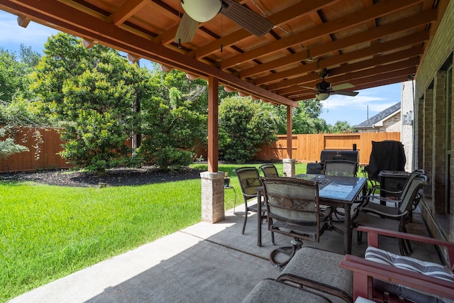 2326 Vinemead Ct, Katy, TX 77450 - fenced backyard featuring ceiling fan, outdoor dining area, and a patio area