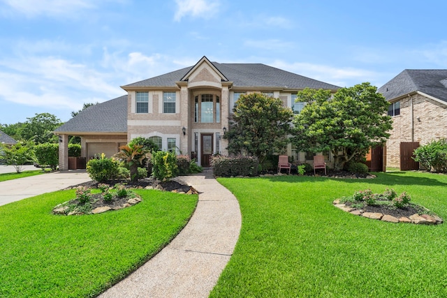 2326 Vinemead Ct, Katy, TX 77450 - colonial inspired home with driveway, brick siding, an attached garage, and a shingled roof