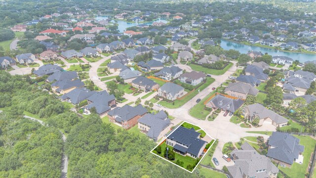 2326 Vinemead Ct, Katy, TX 77450 - aerial view of property and surrounding area with property parcel outlined, a large body of water, and nearby suburban area