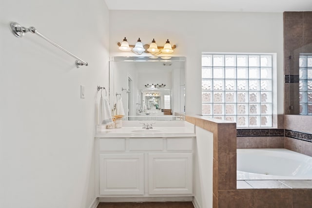 2326 Vinemead Ct, Katy, TX 77450 - bathroom with a whirlpool tub, vanity, and a tile shower