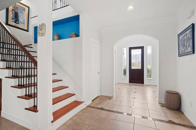 2326 Vinemead Ct, Katy, TX 77450 - tiled entrance foyer with arched walkways, stairs, crown molding, and recessed lighting