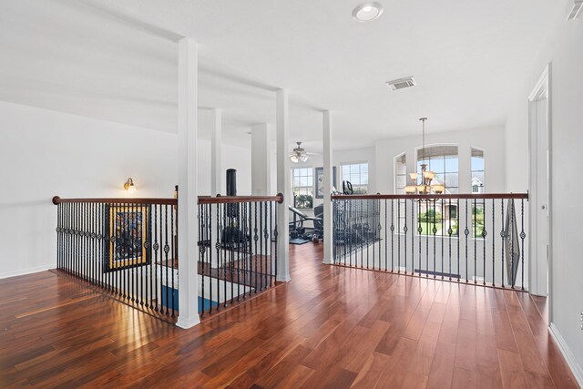 2326 Vinemead Ct, Katy, TX 77450 - hallway with wood finished floors and a chandelier