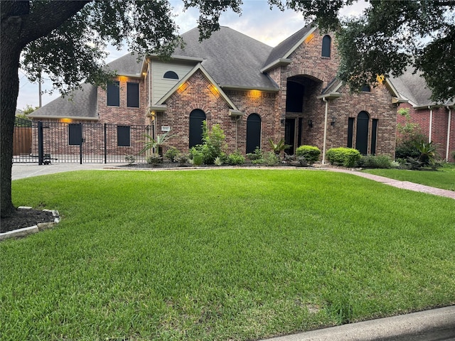 14410 Brentshire Ln, Houston, TX 77069 - french country home featuring brick siding and roof with shingles