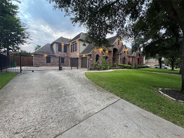 14410 Brentshire Ln, Houston, TX 77069 - view of front of home featuring a gate, brick siding, driveway, and a garage