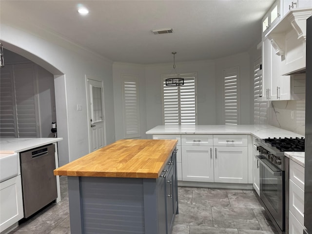 14410 Brentshire Ln, Houston, TX 77069 - kitchen featuring black gas range, butcher block counters, stainless steel dishwasher, white cabinets, and a peninsula