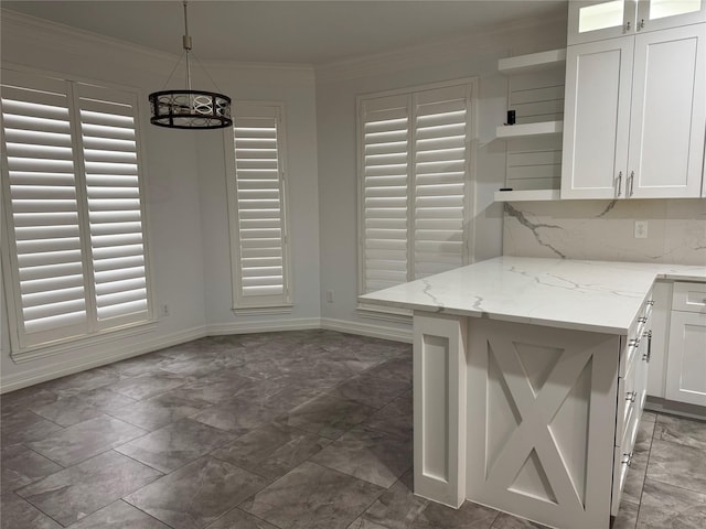 14410 Brentshire Ln, Houston, TX 77069 - kitchen with white cabinetry, a chandelier, ornamental molding, light stone countertops, and hanging light fixtures