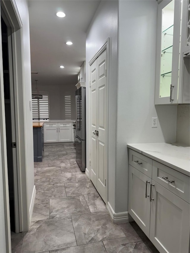 14410 Brentshire Ln, Houston, TX 77069 - hall with recessed lighting and light marble finish flooring