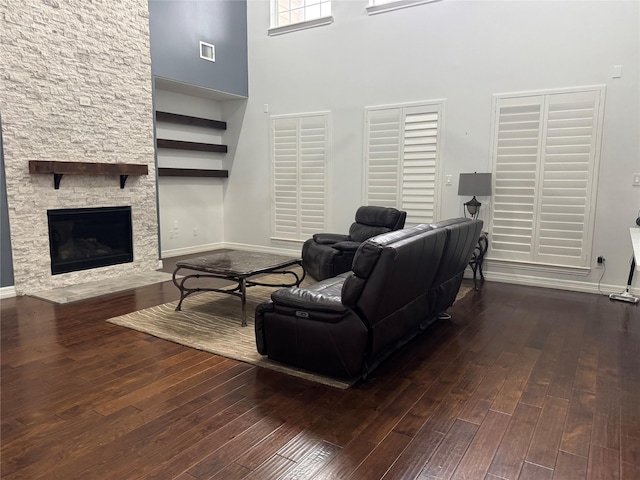 14410 Brentshire Ln, Houston, TX 77069 - living room featuring a towering ceiling, dark wood finished floors, and a stone fireplace