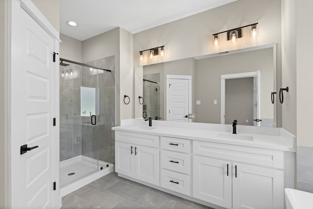 2206 Mansfield, Houston, TX 77091 - full bath with a shower stall, double vanity, recessed lighting, and tile patterned flooring