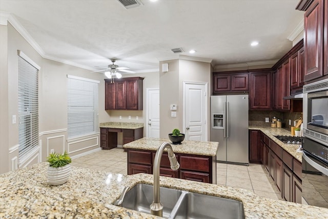 1339 Ella Pl, Houston, TX 77008 - kitchen with stainless steel appliances, dark brown cabinets, decorative backsplash, crown molding, and light tile patterned floors