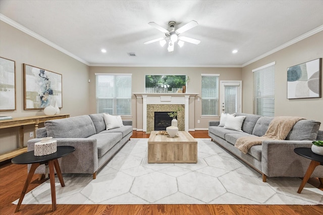 1339 Ella Pl, Houston, TX 77008 - living room featuring ornamental molding, light wood-type flooring, a ceiling fan, recessed lighting, and a fireplace