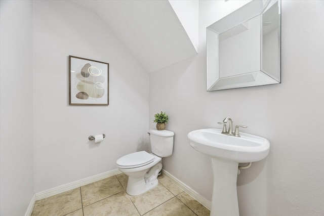 1339 Ella Pl, Houston, TX 77008 - bathroom with lofted ceiling and tile patterned flooring