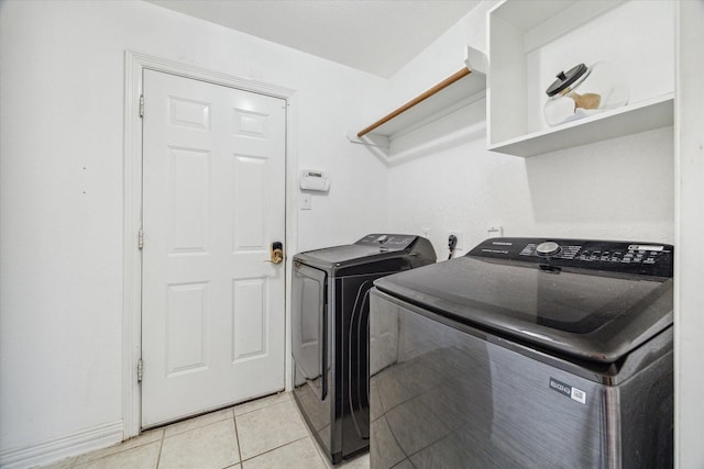 7206 Broadelm Dr, Houston, TX 77095 - laundry area featuring washing machine and dryer and light tile patterned flooring