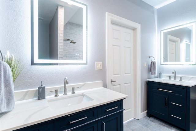 503 Detering St, Houston, TX 77007 - full bathroom with vanity, a textured wall, and a tile shower