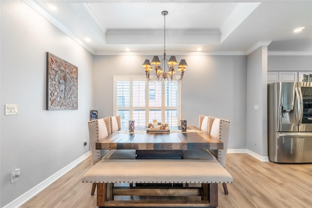503 Detering St, Houston, TX 77007 - dining space featuring light wood-type flooring, a chandelier, a raised ceiling, ornamental molding, and recessed lighting