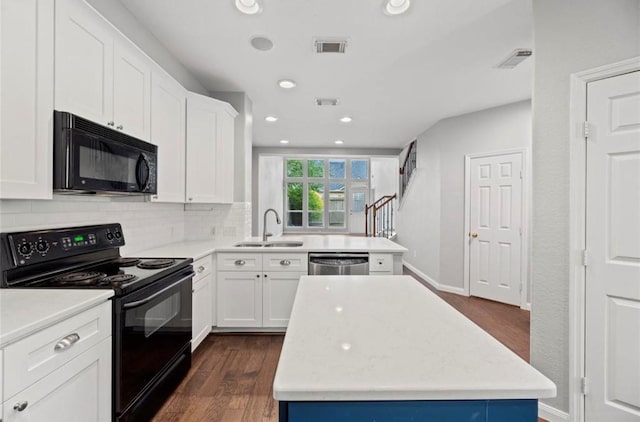 8814 Silent Willow Ln, Sugar Land, TX 77479 - kitchen featuring black appliances, backsplash, light countertops, dark wood-style floors, and recessed lighting