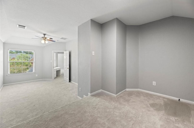 8814 Silent Willow Ln, Sugar Land, TX 77479 - empty room featuring light carpet, a ceiling fan, and lofted ceiling