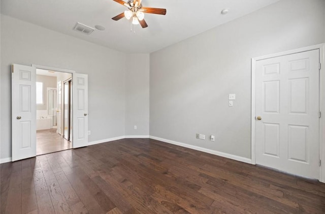 8814 Silent Willow Ln, Sugar Land, TX 77479 - unfurnished bedroom with dark wood finished floors, ensuite bathroom, and a ceiling fan