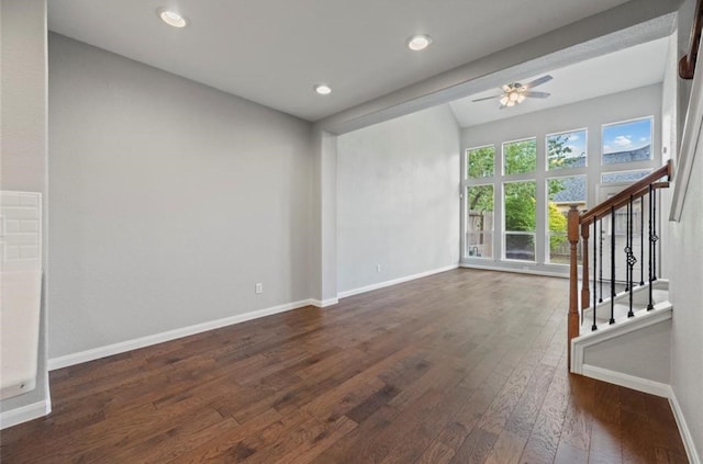 8814 Silent Willow Ln, Sugar Land, TX 77479 - spare room featuring dark wood-style floors, a ceiling fan, lofted ceiling, stairway, and recessed lighting