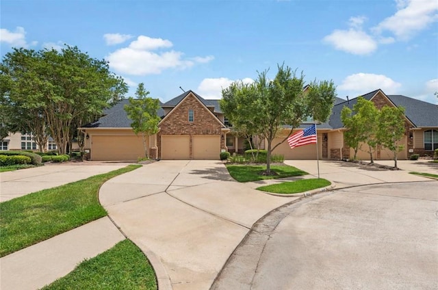 8814 Silent Willow Ln, Sugar Land, TX 77479 - view of front of house featuring concrete driveway and an attached garage