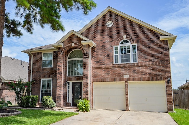 15018 Moss Boulder Ct, Houston, TX 77084 - traditional-style house with brick siding, driveway, and a garage
