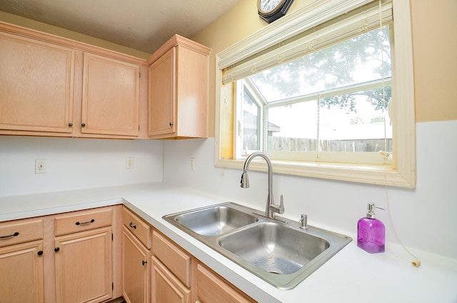 15018 Moss Boulder Ct, Houston, TX 77084 - kitchen featuring light brown cabinetry and light countertops