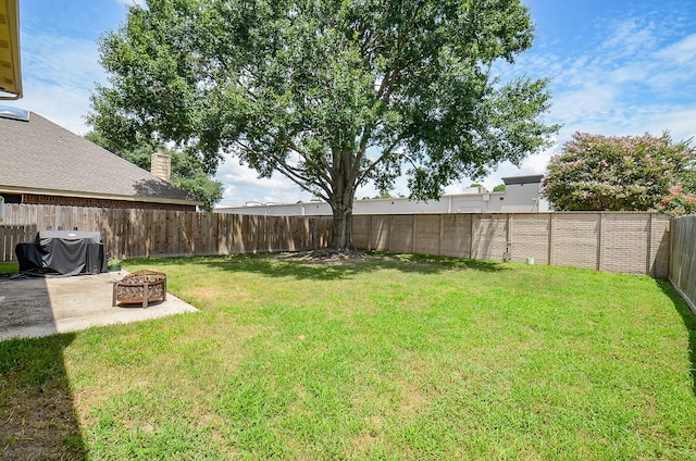 15018 Moss Boulder Ct, Houston, TX 77084 - fenced backyard featuring a patio and a fire pit