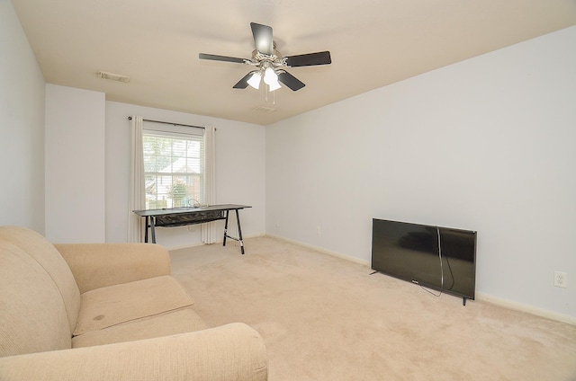 15018 Moss Boulder Ct, Houston, TX 77084 - carpeted living room featuring ceiling fan and baseboards