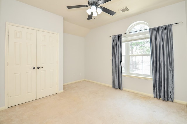 15018 Moss Boulder Ct, Houston, TX 77084 - unfurnished bedroom featuring carpet floors, a closet, a ceiling fan, and lofted ceiling