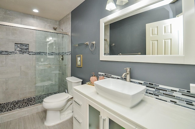 15018 Moss Boulder Ct, Houston, TX 77084 - full bath featuring a stall shower, vanity, backsplash, and recessed lighting