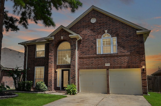 15018 Moss Boulder Ct, Houston, TX 77084 - traditional-style home featuring brick siding, concrete driveway, and an attached garage