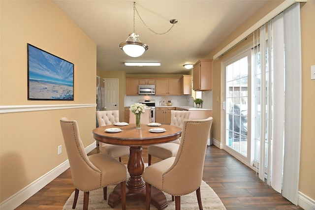 15018 Moss Boulder Ct, Houston, TX 77084 - dining area with dark wood-style floors and baseboards