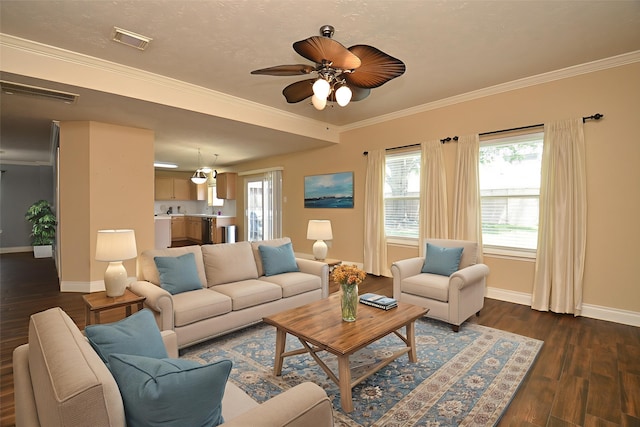 15018 Moss Boulder Ct, Houston, TX 77084 - living area with dark wood-type flooring, ceiling fan, healthy amount of natural light, and crown molding